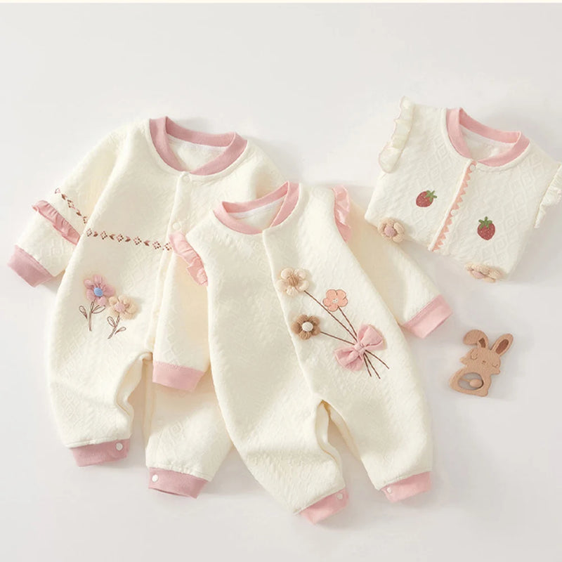 Fashionable display of multiple Little Flowers Adorable Babies Knitted Rompers, showcasing various floral patterns for stylish baby outfits.