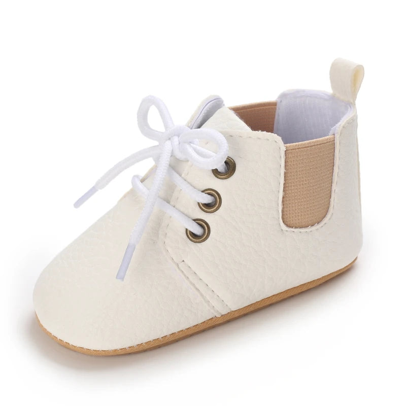 Side view of Retro-Baby Rubber Soled Lace-ups in white, designed for easy movement and perfect for little explorers.