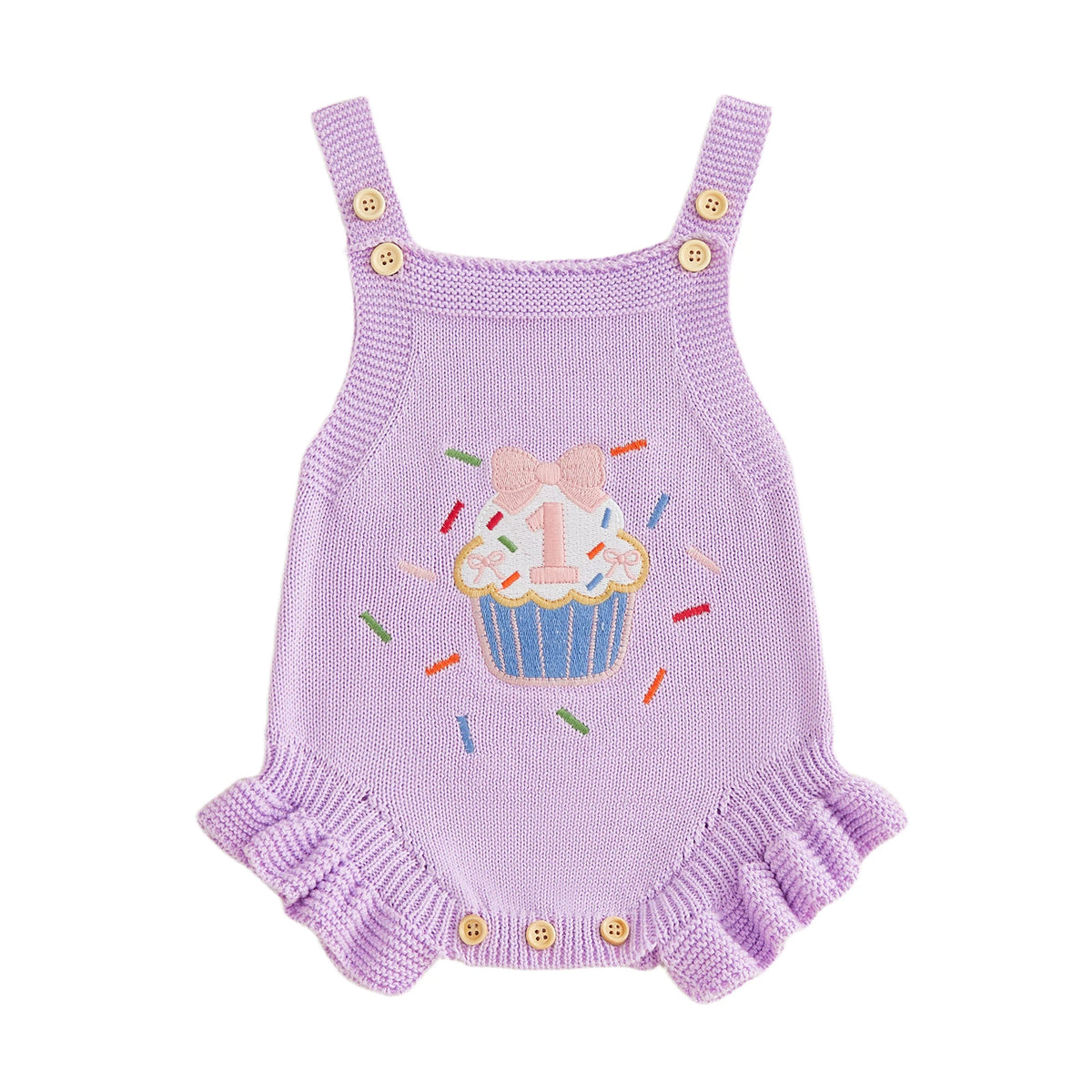 Lilac knit romper overalls with cupcake applique, button straps, and frilled leg cuffs for 1st birthday