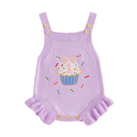 Lilac knit romper overalls with cupcake applique, button straps, and frilled leg cuffs for 1st birthday