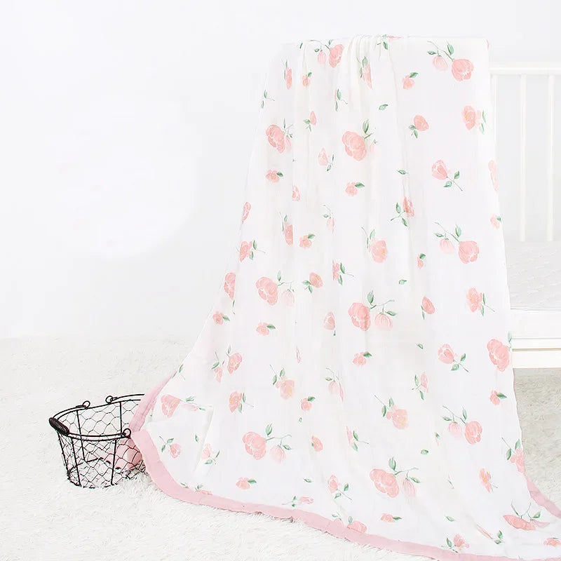 Two-layer bamboo cotton newborn swaddle blanket with pink floral pattern and pink trim.
