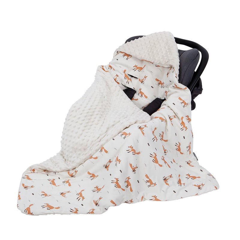 Adorable Ultra-Soft Baby Swaddle Blanket featuring a playful fox design, artistically draped over a car seat to enhance baby comfort.