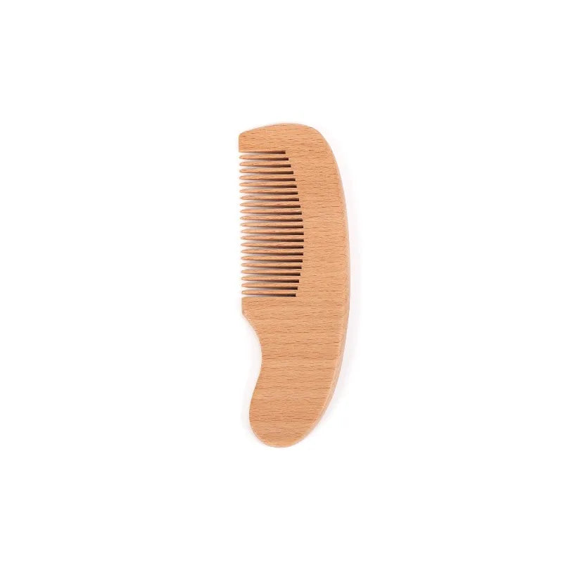 Natural wooden baby to toddler comb with rounded handle and fine teeth.