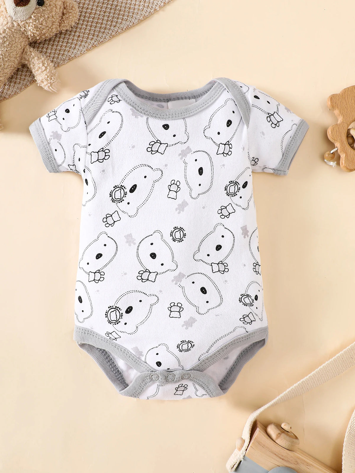 8-piece layette set in combed cotton with a cute grey bear print for 0-9M infants.