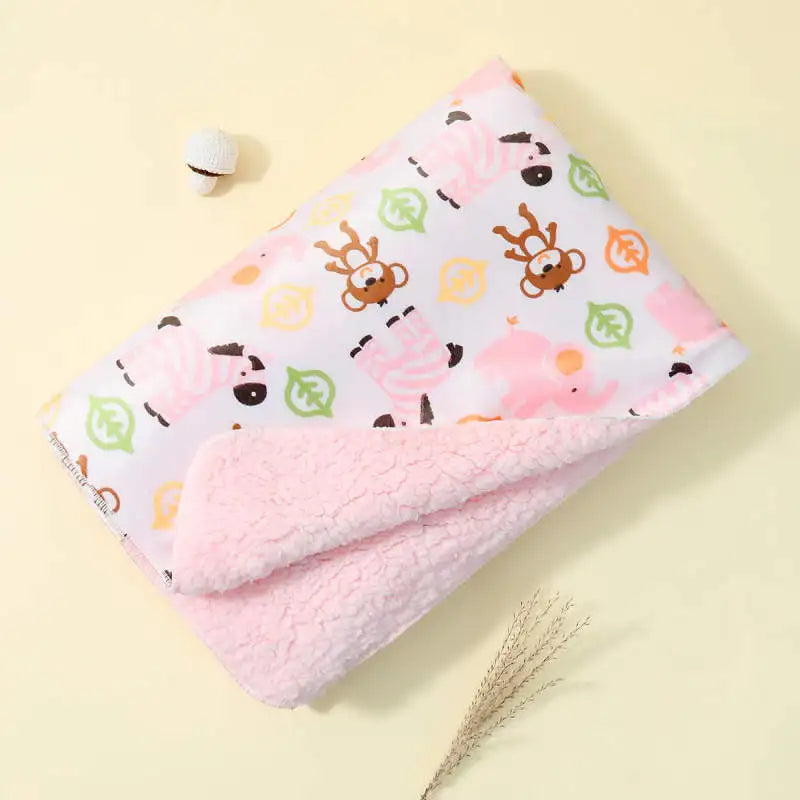 Lightweight ultra-soft children's micro-plush reversible blanket with pastel animal prints and pink plush reverse.