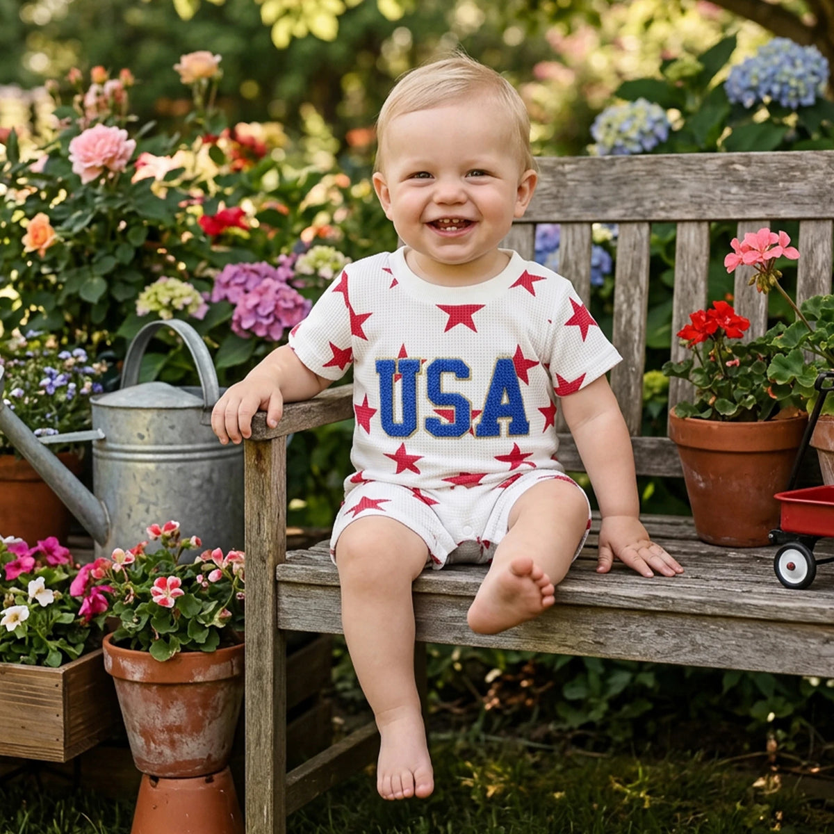 Freddie USA Embroidered Patriotic Romper for Toddlers displayed neatly, showcasing the snap closures for easy dressing and the charming star pattern, perfect for patriotic celebrations.
