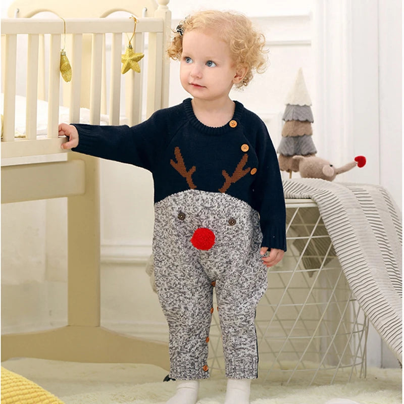 A bright red winter knit romper with holiday motifs, paired with a matching hat, from the 'Winter Sweeties' collection for cheerful winter days.