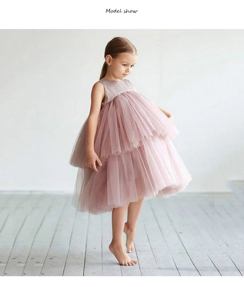 Cara Ann girls tiered pink tulle party dress with empire waist, round neckline, mid-calf length.