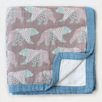Two-layer bamboo cotton baby swaddle blanket with teal elephants on mauve and blue trim.