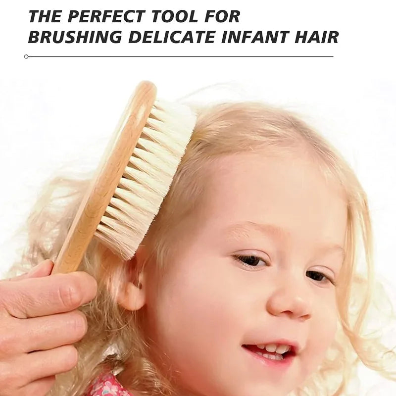 Wooden baby brush with soft bristles brushing a toddler's blonde hair.