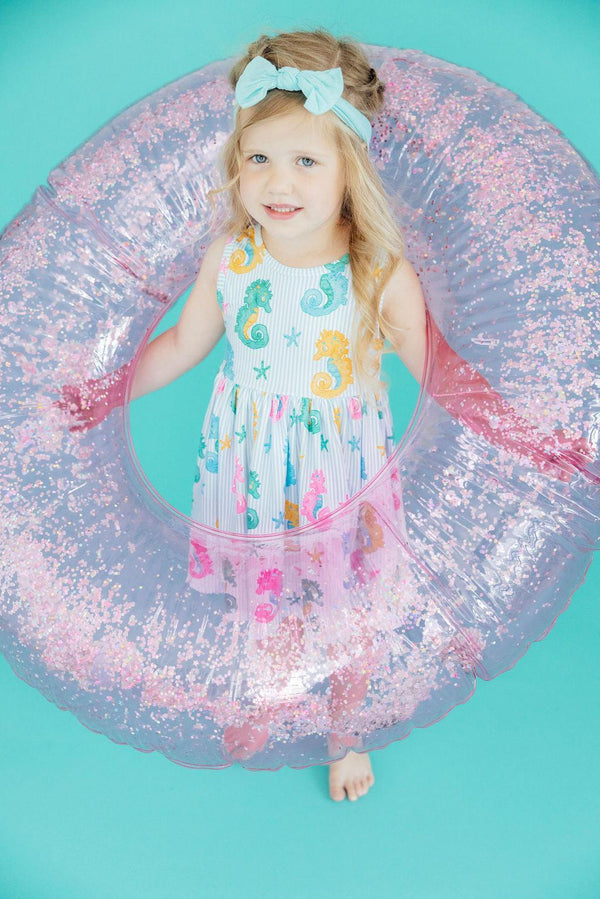 Close-up of the Seahorse Swirl Tank Twirl Dress for girls, featuring a vibrant seahorse pattern and soft fabric.