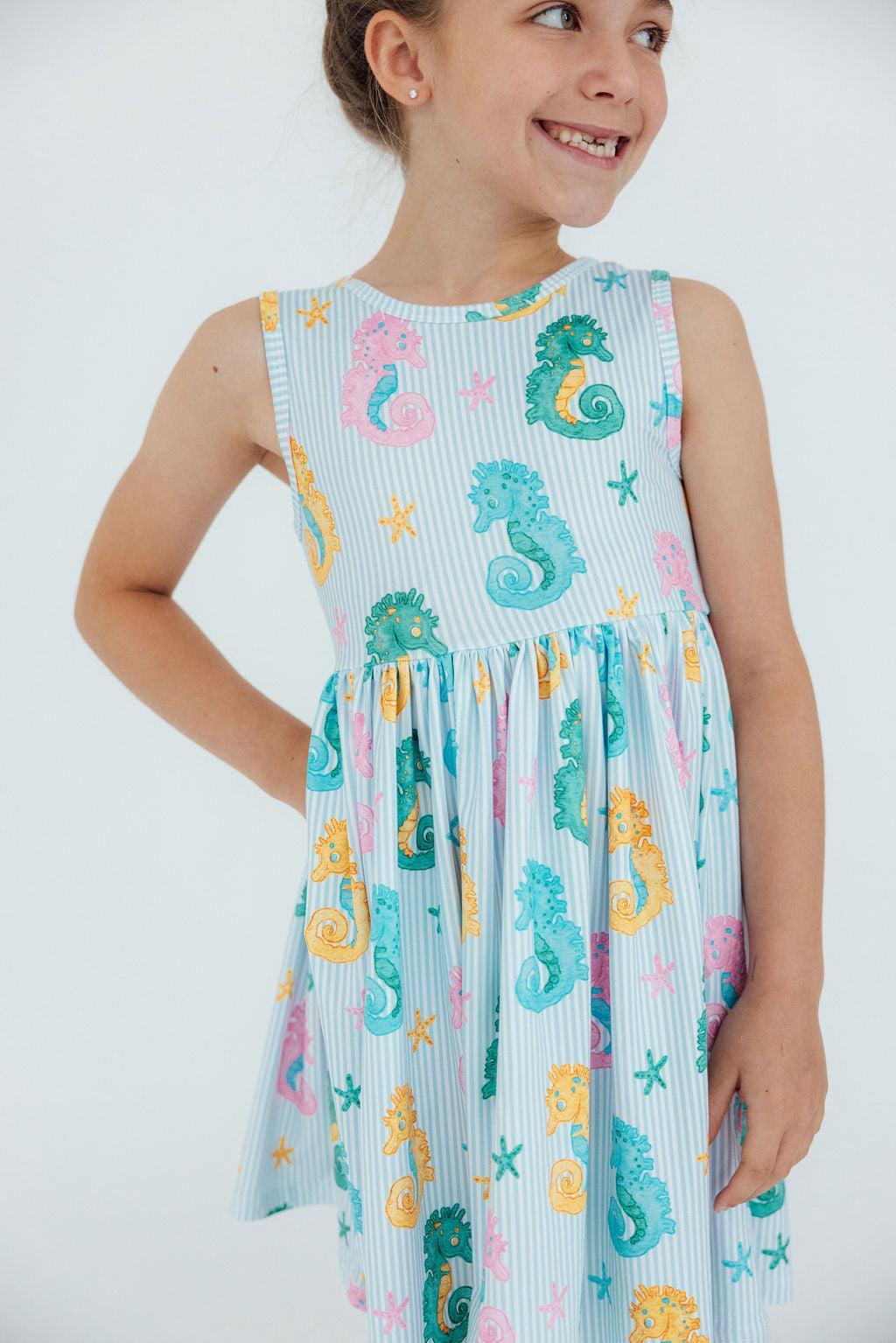 Seahorse Swirl Tank Twirl Dress for girls, showcasing a playful and swishy skirt perfect for twirling.