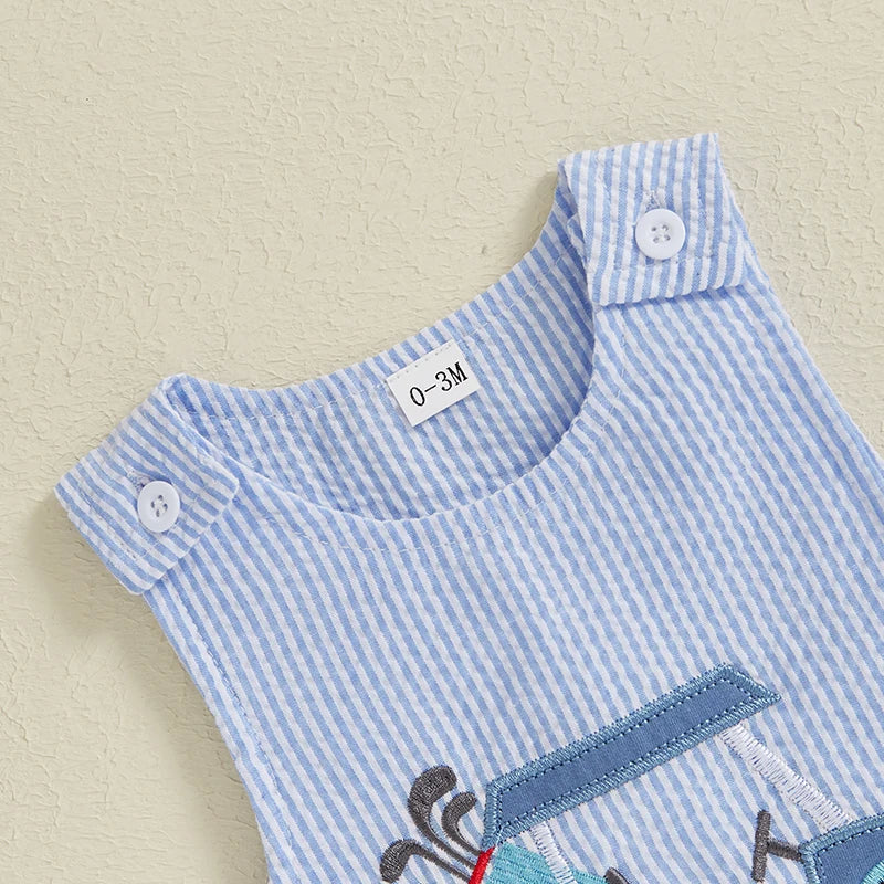 Close-up of the shoulder buttons on Hitting the Links, Baby! Boys Golf Cart Romper - Blue Stripe Seersucker, designed for easy dressing.