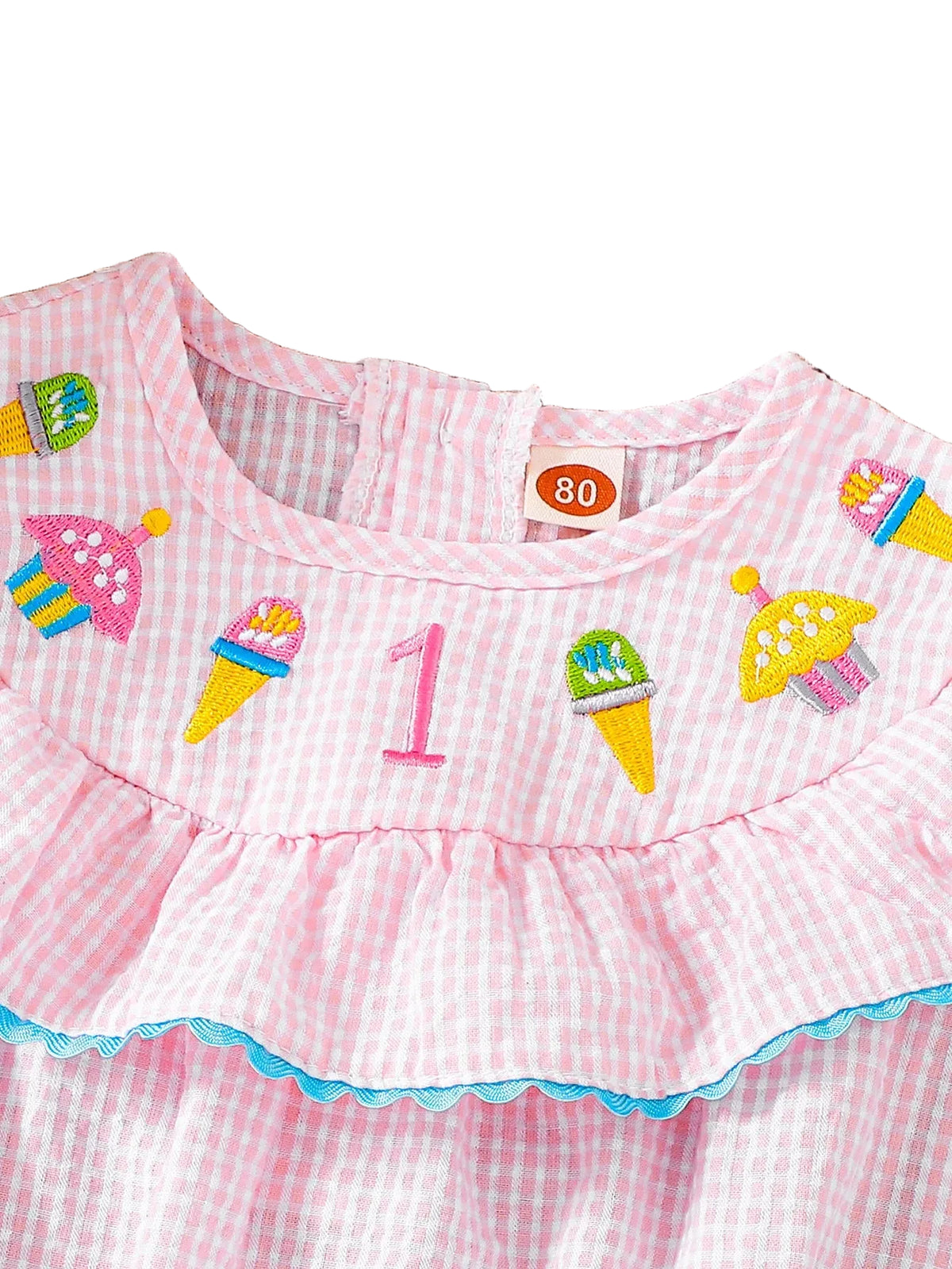 Pink striped birthday bubble dress with colorful ice cream cone and cupcake embroidery, blue trim, ruffled hem.