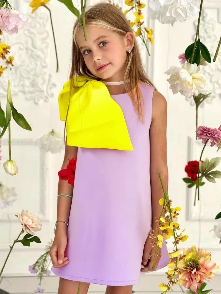 Girls lavender sleeveless party dress with large yellow bow detail for ages 4 to 6