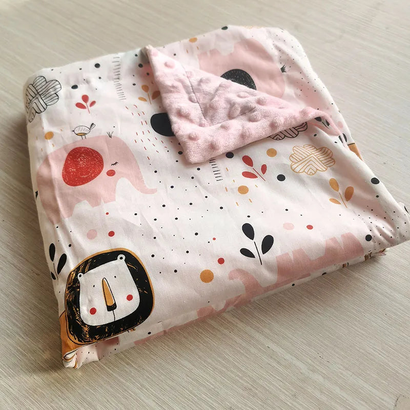 Two-sided children's minky blanket with cute pastel prints and raised dot texture, 100x75 cm.