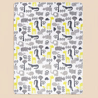 Lightweight micro-plush children's blanket with four colorful, reversible animal prints on white.