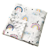 Childrens Minky blanket, white with rainbow prints, clouds and stars; two-sided with raised dots, 100 x 75 cm.
