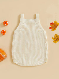 Cream ribbed knit romper overalls for babies, styled with mini pumpkins and autumn leaves for a cozy seasonal look.