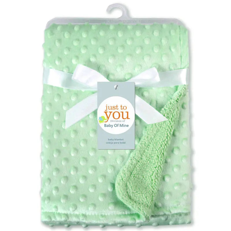 Mint green dotted fleece baby blanket with white ribbon and tag reading just you, 100x70 cm, for ages 0-6 years.