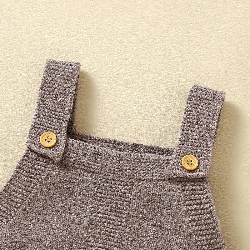 Close-up of the button details on the straps of the Nature's Colors Knitted Baby Romper Overalls, designed for easy dressing.