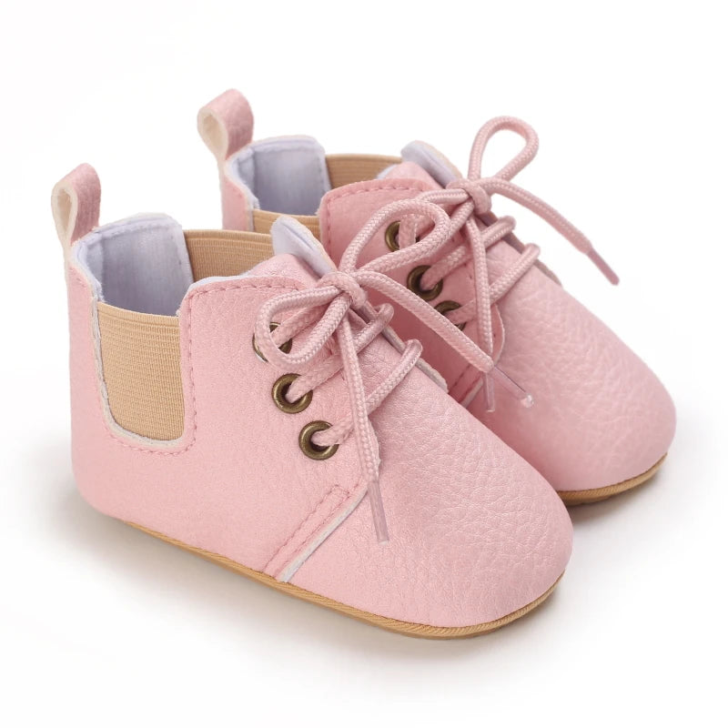 Retro-Baby Rubber Soled Lace-ups in pink color, perfect for little ones aged 0 to 18 months, combining style and practicality.