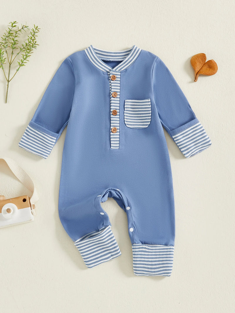 Hudson Button-Down Stripe Romper in blue displayed on a flat surface, featuring a charming design with buttons and a front pocket details for trendy baby outfits.