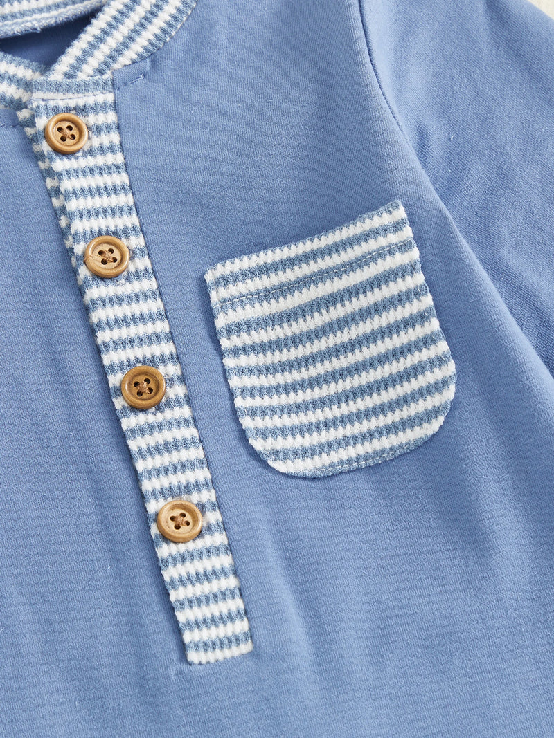 Close-up of the Hudson Button-Down Stripe Romper in blue, focusing on the button details and front pocket design, perfect for trendy baby clothing.