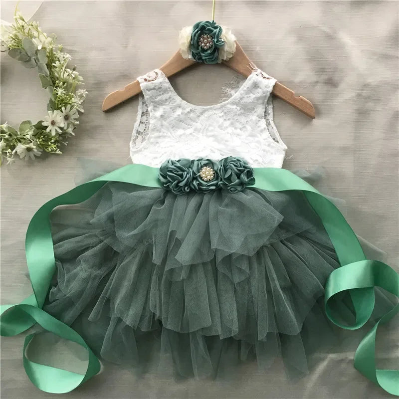 Elegant Roxane vintage-inspired girls’ beaded dress set with white lace bodice, green tulle skirt, belt and headband.