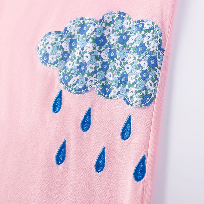 Detail of a cloud applique with floral patterns and raindrops on the Little Rainbow Girls Casual Dress, perfect for playful summer outings.