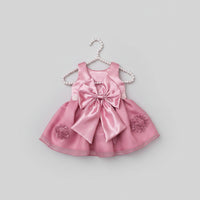 Pink satin infant dress with an oversized bow and matching beaded headband, a 2-piece set for special occasions.