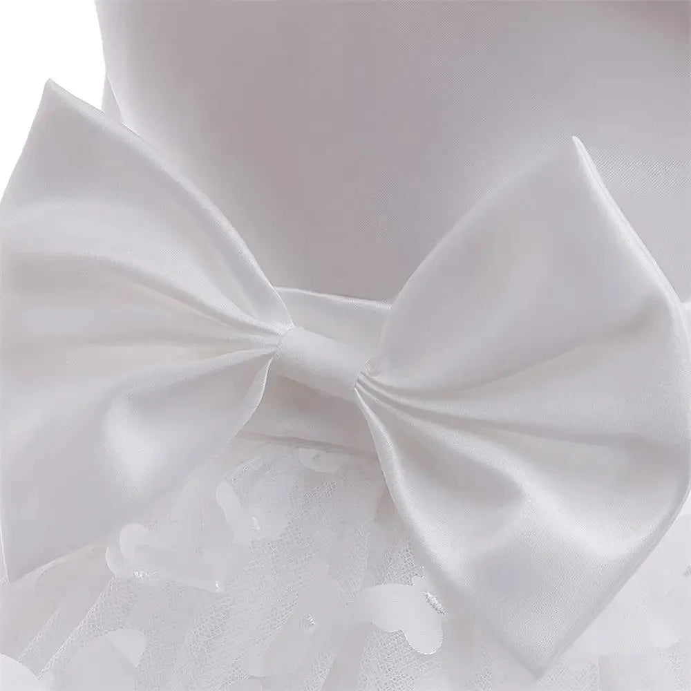 Butterfly Wishes formal dress with large white satin bow and lace overlay.