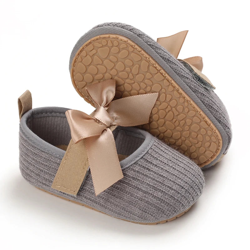 Baby Jane Satin Bow Baby Shoes in gray with rubber soles, combining comfort and style for your little one.