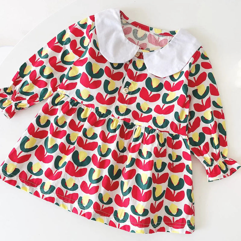 The "Mariella" Floral Print Peter Pan Collar Dress in a bright red floral design, perfect for young girls looking stylish.