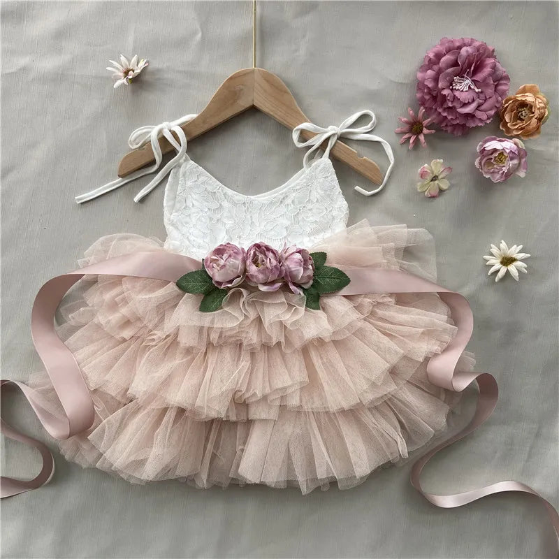 Cecilia Vintage Tiered Tulle Dress with lace bodice, pink layered skirt, and floral belt for babies and toddlers.