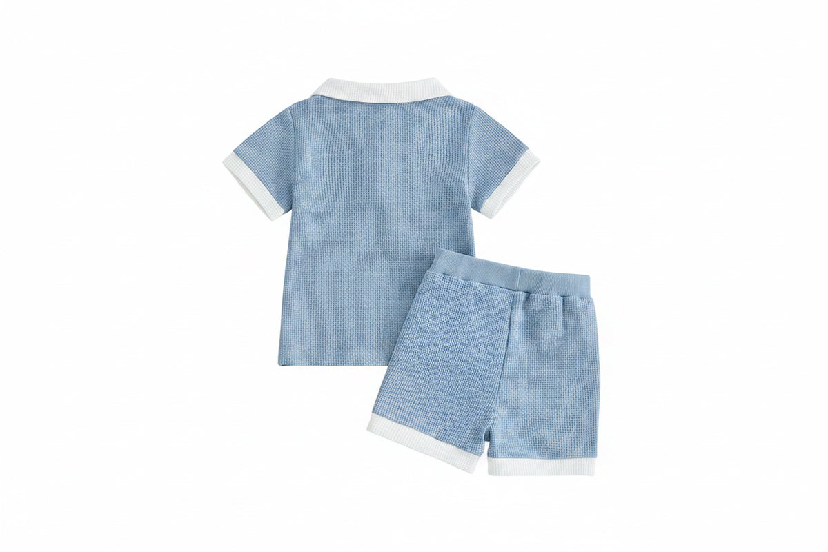 Ocean Breezes boys 2-piece polo shorts set in light blue waffle-knit with white collar and cuffs, matching shorts.