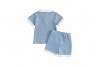 Ocean Breezes boys 2-piece polo shorts set in light blue waffle-knit with white collar and cuffs, matching shorts.