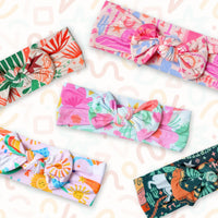 Pink Here Comes the Sunshine SoftKnot bow head-wrap for baby on bamboo fabric, cozy, joyful print