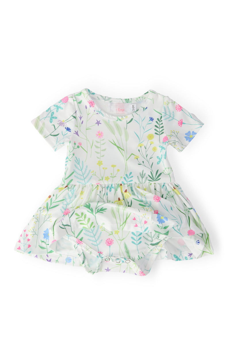 Back view of the Spring Dandelion Floral S/S Twirl Bodysuit by Mila & Rose, highlighting the twirl-friendly design and vibrant floral print, ideal for playful days.