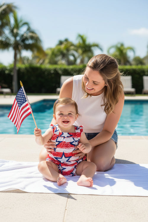 Stars & Stripes Ruffle Cross Back Romper for Toddlers featuring playful design with criss-cross back straps.