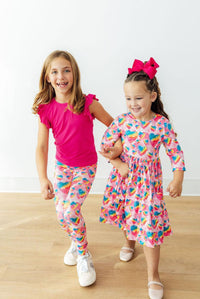 Sugar & Spice 3/4 Sleeve Pocket Twirl Dress worn by kids in bright heart-print outfits; twirl-ready, soft fabric.