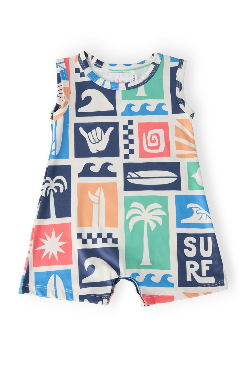 Summer Surfer Shorty One-Piece swimsuit for boys in a bright grid print with waves and palm icons; diaper-snaps.