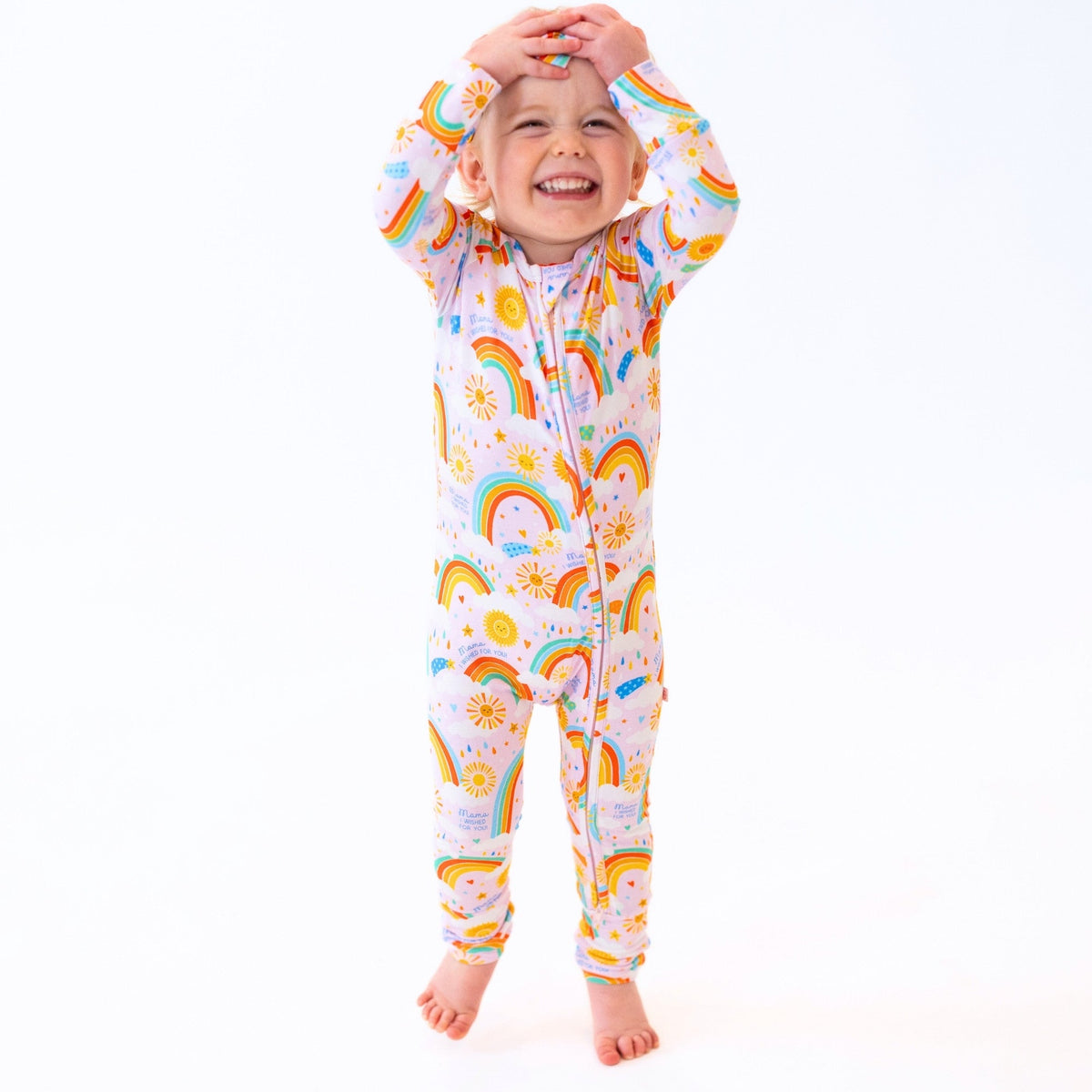 Toddler playing outdoors in The Second-Skin Convertible Romper for Toddlers | Here Comes the Sunshine, ideal for fun and adventure, as it is a convertible romper for toddlers.