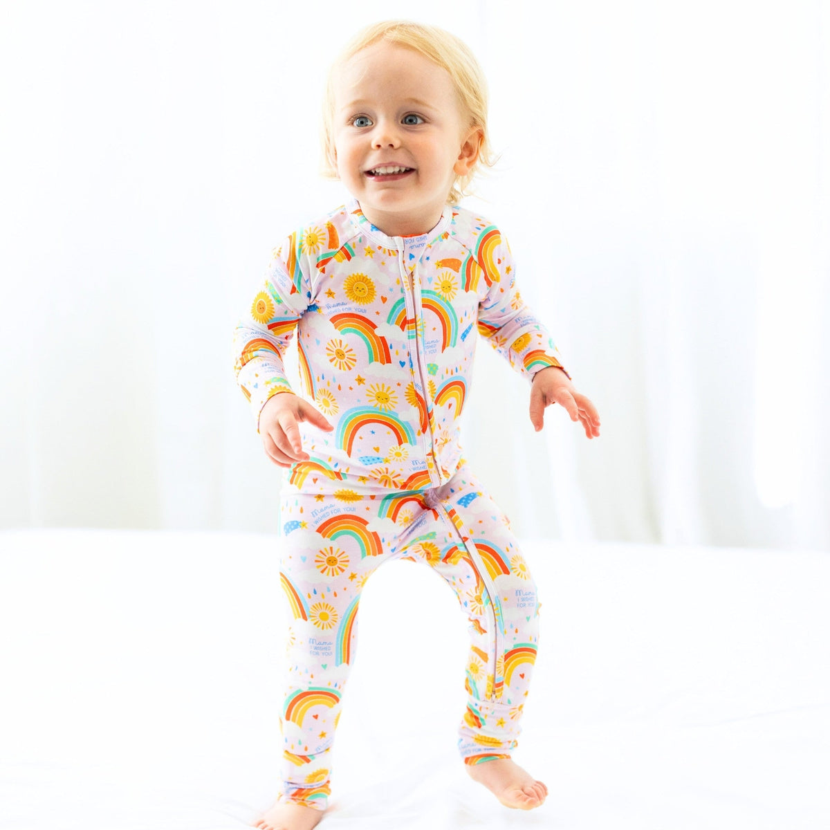 The Second-Skin Convertible Romper for Toddlers | Here Comes the Sunshine on display with soft bamboo fabric, representing the features of a convertible romper for toddlers.