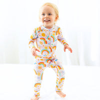 The Second-Skin Convertible Romper for Toddlers | Here Comes the Sunshine on display with soft bamboo fabric, representing the features of a convertible romper for toddlers.