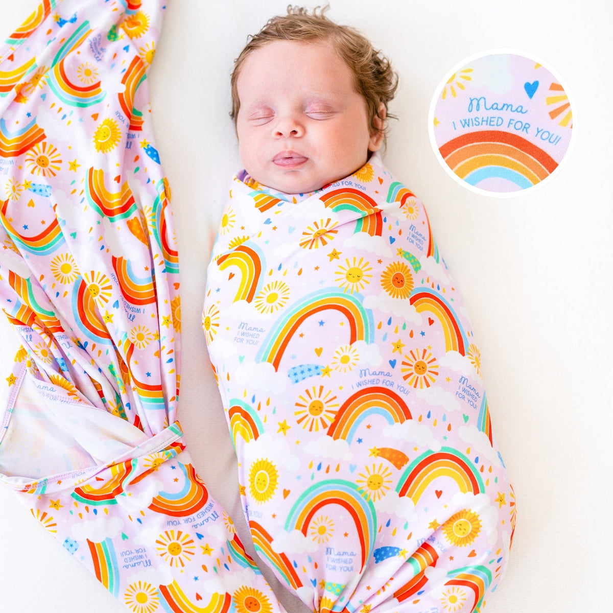 The Forever Swaddle Blanket - Here Comes the Sunshine (Pink) featuring a baby peacefully swaddled in a colorful rainbow-patterned blanket with suns and clouds, promoting comfort and joy.