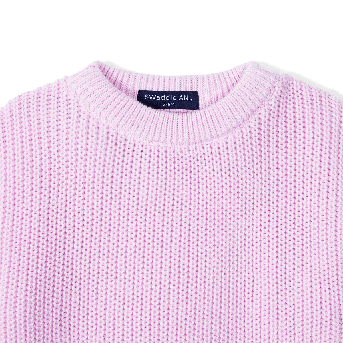 Crew neck detail of lilac romper with ribbed stitching and visible size tag