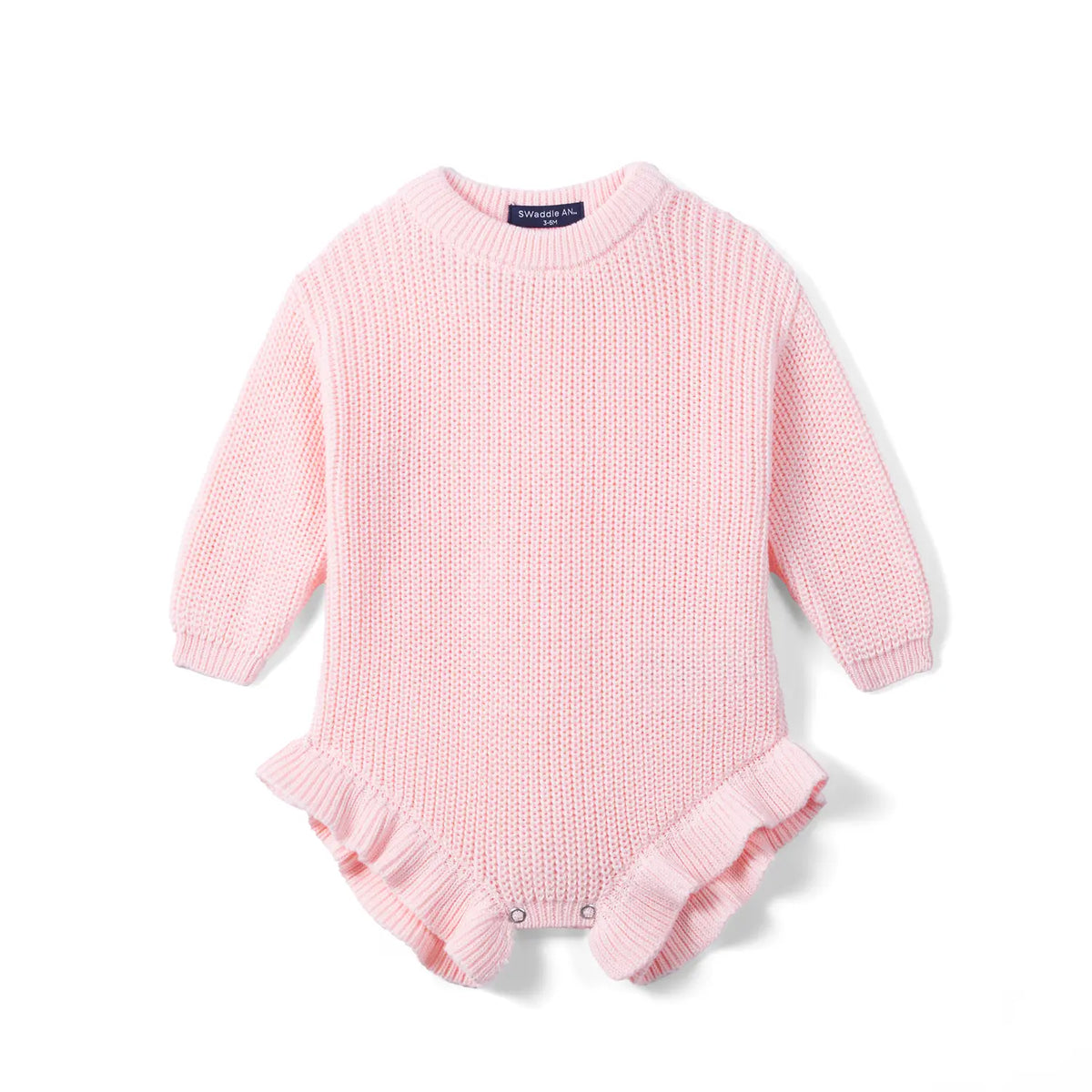 Light pink chunky knit baby romper with ribbed cuffs and ruffled leg openings on white background