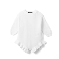 White chunky knit baby romper flat lay with ribbed cuffs, ruffled leg openings, and snap buttons