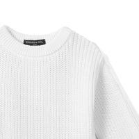 High-angle view of shoulder knit structure and black size tag stitching on white romper